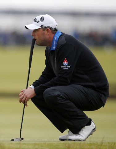 Australia's Marc Leishman waits to putt during his final round 66, on day five of the 2015 British Open Golf Championship on The Old Course at St Andrews in Scotland, on July 20, 2015. The weather-affected championship, finishes on Monday for only the second time in 155 years. Australia's Marc Leishman was leading the British Open by one stroke after playing 13 holes in his final round at St Andrews on Monday. AFP PHOTO / ADRIAN DENNIS        (Photo credit should read ADRIAN DENNIS/AFP/Getty Images)