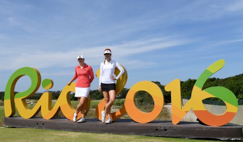 RIO DE JANEIRO, BRAZIL - AUGUST 16: Caroline Masson and Sandra Gal of Germany pose by the Rio 2016 sign prior to the Women's Individual Stroke Play golf at the Olympic Golf Course at Olympic Golf Course on August 16, 2016 in Rio de Janeiro, Brazil. (Photo by Ross Kinnaird/Getty Images)