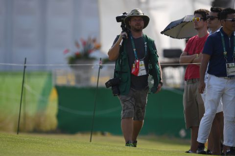 AFP Photographer Jim Watson walks the golg course during the Women's individual stroke play at the Olympic Golf course during the Rio 2016 Olympic Games in Rio de Janeiro on August 18, 2016. / AFP / Greg BAKER (Photo credit should read GREG BAKER/AFP/Getty Images)