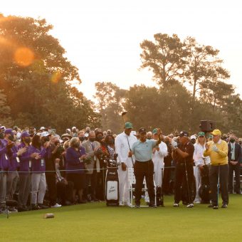 Honorary Starter Lee Elder of the United States (L), waves to the crowd as he is introduced and honorary starter and Masters champion Gary Player of South Africa and honorary starter and Masters champion Jack Nicklaus look on from the first tee during the opening ceremony prior to the start of the first round of the Masters at Augusta National Golf Club on April 08, 2021 in Augusta, Georgia. (Photo by Jared C. Tilton/Getty Images)