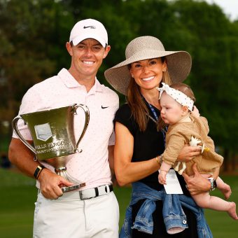 Rory McIlroy of Northern Ireland celebrates with the trophy alongside his wife Erica and daughter Poppy after winning during the final round of the 2021 Wells Fargo Championship at Quail Hollow Club on May 09, 2021 in Charlotte, North Carolina. (Photo by Jared C. Tilton/Getty Images)
