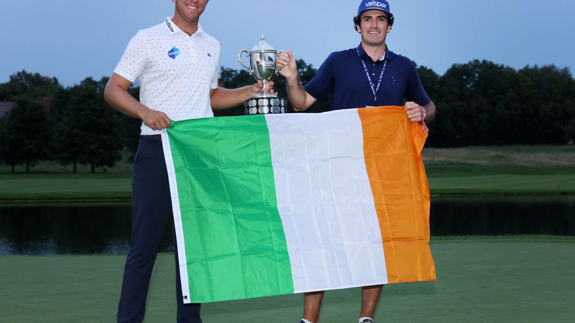 NICHOLASVILLE, KENTUCKY - JULY 18: Seamus Power of Ireland poses with the trophy and his caddie Aaron Flener after putting in to win on the 18th hole during the sixth playoff hole during the final round of the Barbasol Championship at Keene Trace Golf Club on July 18, 2021 in Nicholasville, Kentucky. (Photo by Andy Lyons/Getty Images)