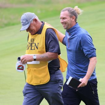 SANDWICH, ENGLAND - JULY 15: Marcel Siem of Germany reacts with his caddie as he walks off the 18th green after making a birdie during Day One of The 149th Open at Royal St George’s Golf Club on July 15, 2021 in Sandwich, England. (Photo by Chris Trotman/Getty Images)