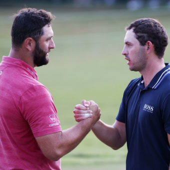 ATLANTA, GEORGIA - SEPTEMBER 05: Jon Rahm of Spain congratulates Patrick Cantlay of the United States on the 18th green after Cantlay won during the final round of the TOUR Championship at East Lake Golf Club on September 05, tour news, 2021 in Atlanta, Georgia. (Photo by Kevin C. Cox/Getty Images)