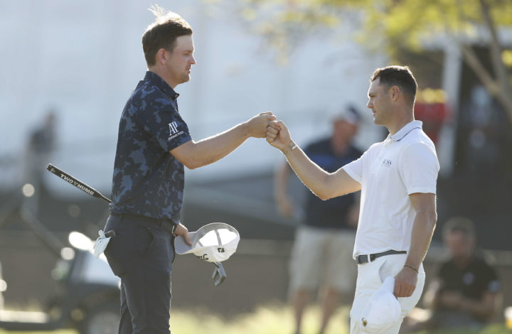 DUBAI, UNITED ARAB EMIRATES - NOVEMBER 14: Bernd Wiesberger of Austria and Martin Kaymer of Germany on the 18th green during the final round of The AVIV Dubai Championship at Fire Course, Jumeirah Golf Estates on November 14, 2021 in Dubai, United Arab Emirates. (Photo by Oisin Keniry/Getty Images)