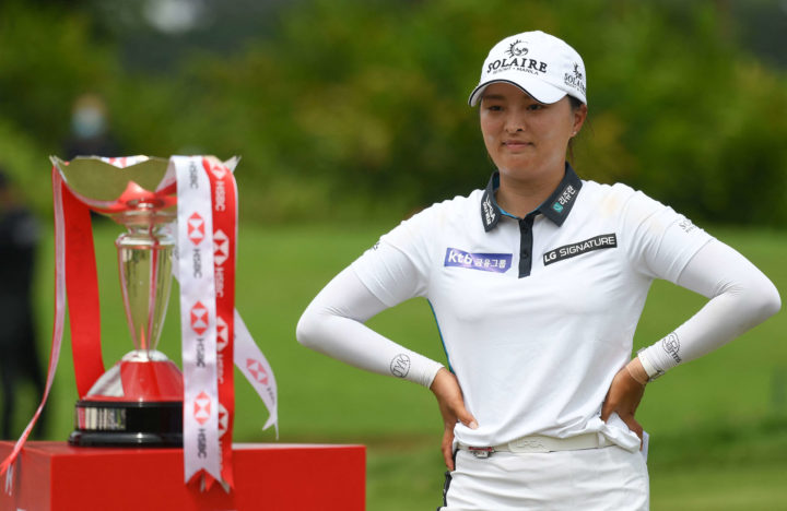 South Korea's Ko Jin-young looks at the trophy after winning the HSBC Women's World Championship golf tournament at the Sentosa Golf Club in Singapore on March 6, 2022. tour news (Photo by Roslan RAHMAN / AFP) (Photo by ROSLAN RAHMAN/AFP via Getty Images)