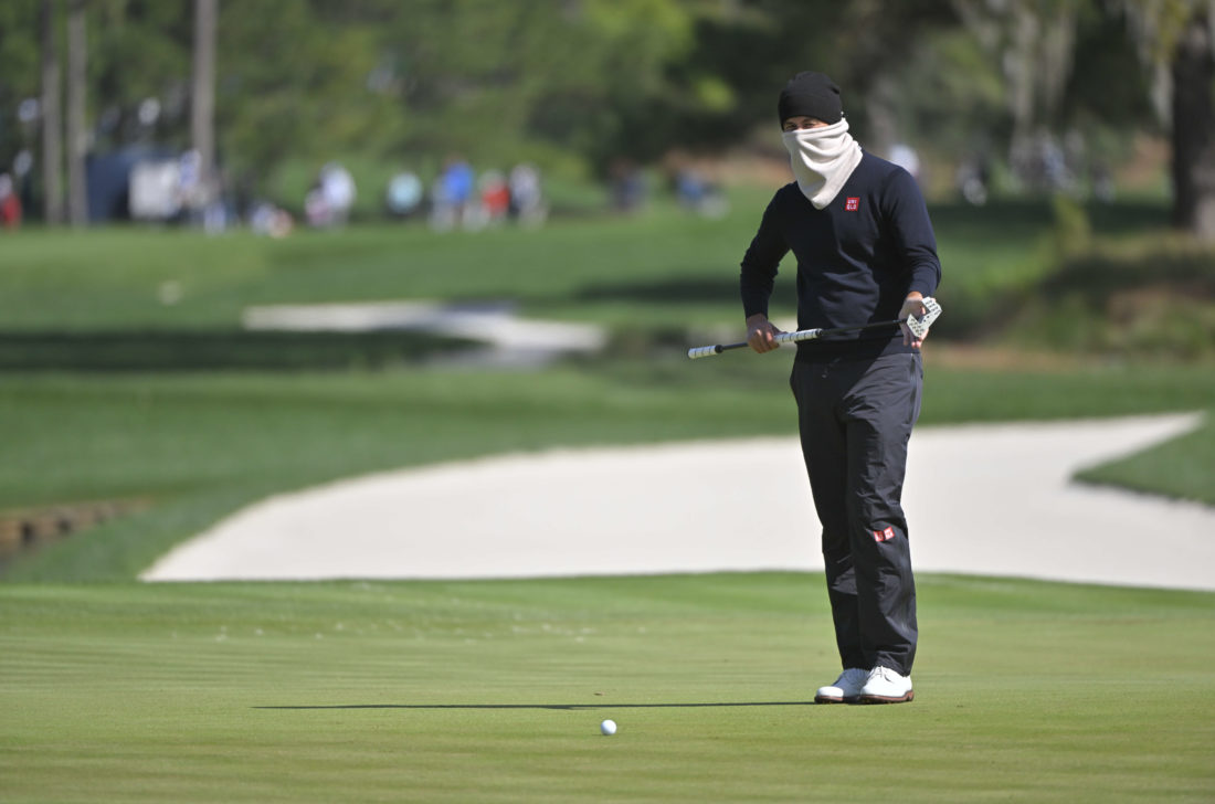 PONTE VEDRA BEACH, FL - MARCH 13: A bundled up Adam Scott of Australia looks over a putt during the second round of THE PLAYERS Championship on THE PLAYERS Stadium Course at TPC Sawgrass on March 13, 2022, in Ponte Vedra Beach, FL. (Photo by Ben Jared/PGA TOUR via Getty Images) tour news