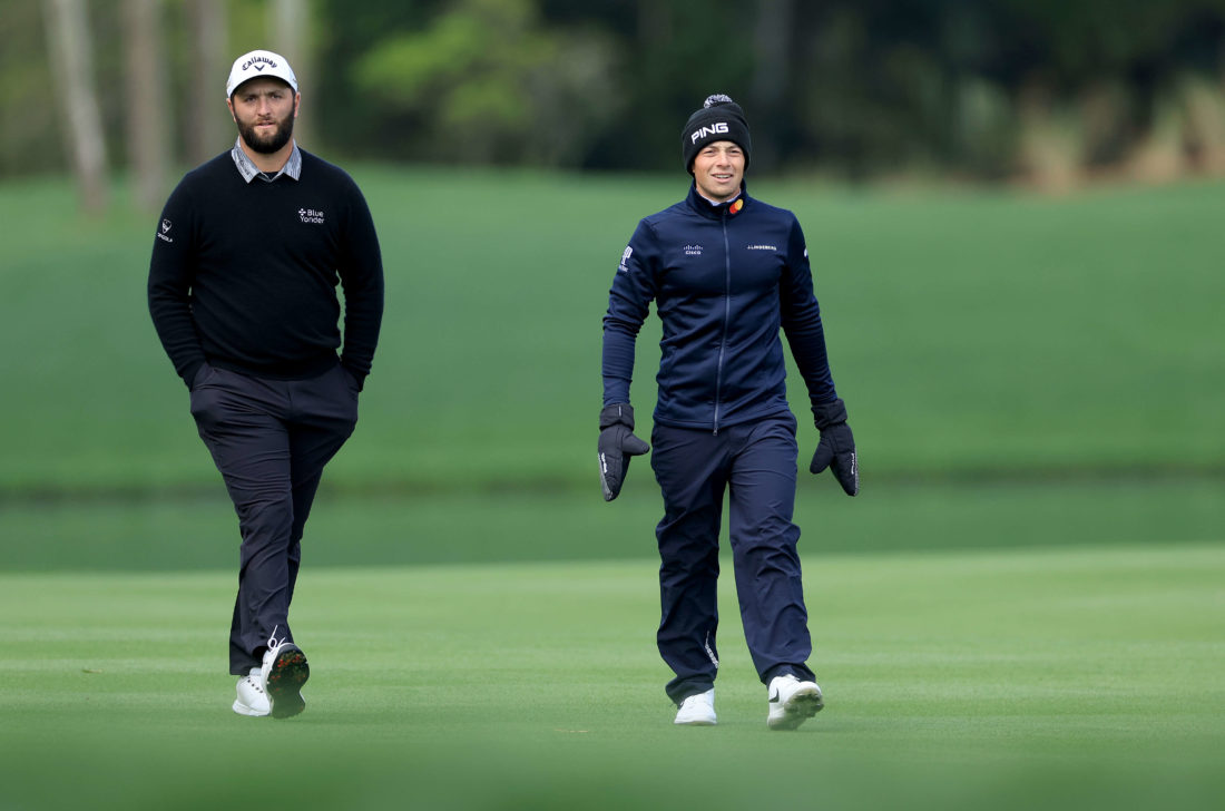 PONTE VEDRA BEACH, FLORIDA - MARCH 13: Viktor Hovland of Norway and Jon Rahm of Spain walk to their second shots on the par 4, seventh hole wrapped up against the extreme cold during the weather delayed completion of the second round of THE PLAYERS Championship at TPC Sawgrass on March 13, 2022 in Ponte Vedra Beach, Florida. (Photo by David Cannon/Getty Images) tour news