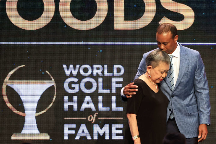 PONTE VEDRA BEACH, FLORIDA - MARCH 09: Tiger Woods and his mother Kultida Woods react as they pose for photos prior to his induction at the 2022 World Golf Hall of Fame Induction at the PGA TOUR Global Home on March 09, 2022 in Ponte Vedra Beach, Florida. (Photo by Sam Greenwood/Getty Images)