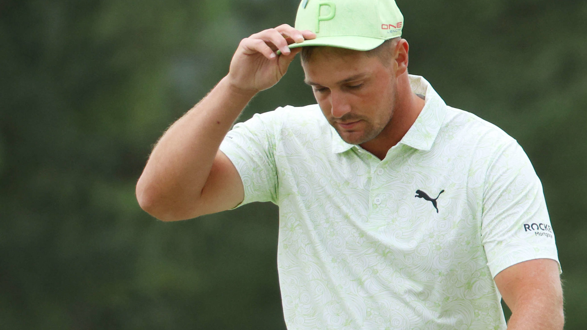 AUGUSTA, GEORGIA - APRIL 08: Bryson DeChambeau reacts on the 18th green after finishing his round during the second round of The Masters at Augusta National Golf Club on April 08, 2022 in Augusta, Georgia. (Photo by Andrew Redington/Getty Images)