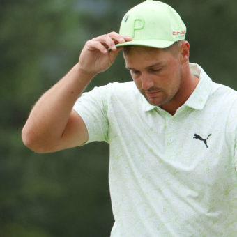 AUGUSTA, GEORGIA - APRIL 08: Bryson DeChambeau reacts on the 18th green after finishing his round during the second round of The Masters at Augusta National Golf Club on April 08, 2022 in Augusta, Georgia. (Photo by Andrew Redington/Getty Images)