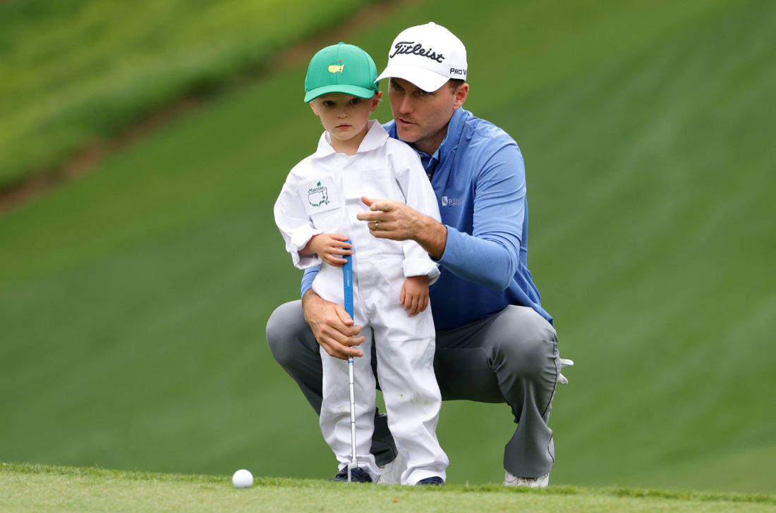 AUGUSTA, GEORGIA - APRIL 06: Russell Henley of the United States and son Robert Henley during the Par Three Contest prior to the Masters at Augusta National Golf Club on April 06, 2022 in Augusta, Georgia. (Photo by Jamie Squire/Getty Images)