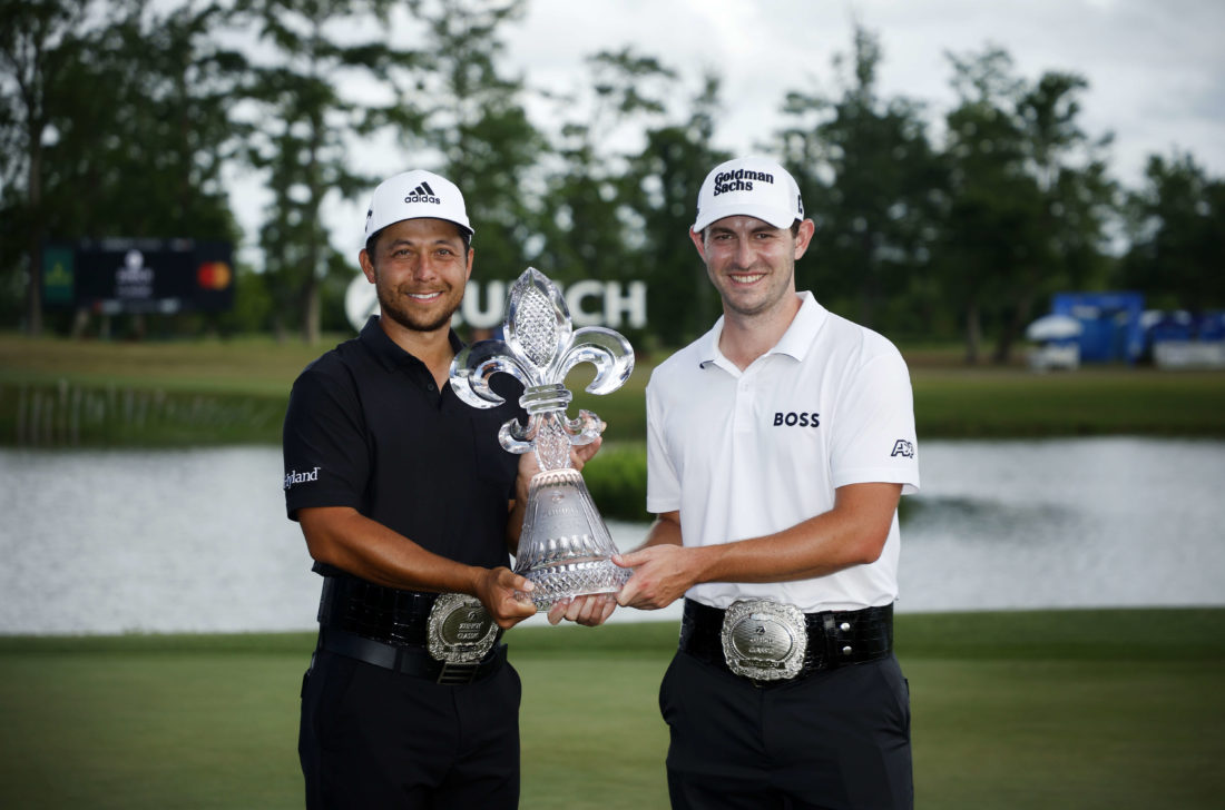 AVONDALE, LOUISIANA - APRIL 24: Xander Schauffele and Patrick Cantlay pose with the trophy after putting in to win on the 18th green during the final round of the Zurich Classic of New Orleans at TPC Louisiana on April 24, 2022 in Avondale, Louisiana. (Photo by Chris Graythen/Getty Images) tour news