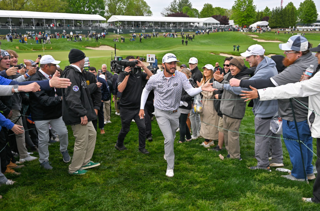 POTOMAC, MD - MAY 08: Max Homa high fives fans while walking off the 18th green after the final round of the Wells Fargo Championship at TPC Potomac at Avenel Farm on May 8, 2022 in Potomac, Maryland.tour news (Photo by Ben Jared/PGA TOUR via Getty Images)