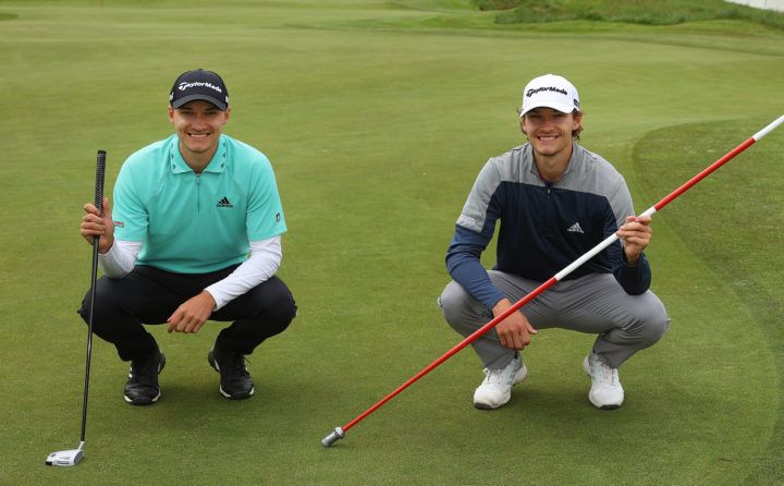 AALBORG, DENMARK - MAY 25: Rasmus Højgaard of Denmark and Nicolai Højgaard of Denmark pose for a photograph on the first green during a practice day prior to the start of Made in HimmerLand presented by FREJA at Himmerland Golf & Spa Resort on May 25, 2021 in Aalborg, Denmark. (Photo by Andrew Redington/Getty Images)