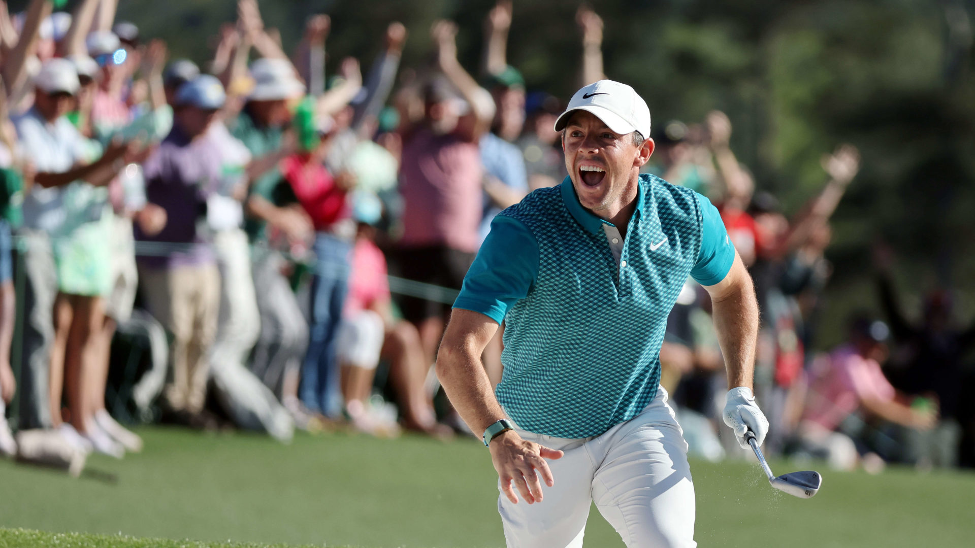 AUGUSTA, GEORGIA - APRIL 10: Rory McIlroy of Northern Ireland reacts after chipping in for birdie from the bunker on the 18th green during the final round of the Masters at Augusta National Golf Club on April 10, 2022 in Augusta, Georgia. (Photo by Gregory Shamus/Getty Images)