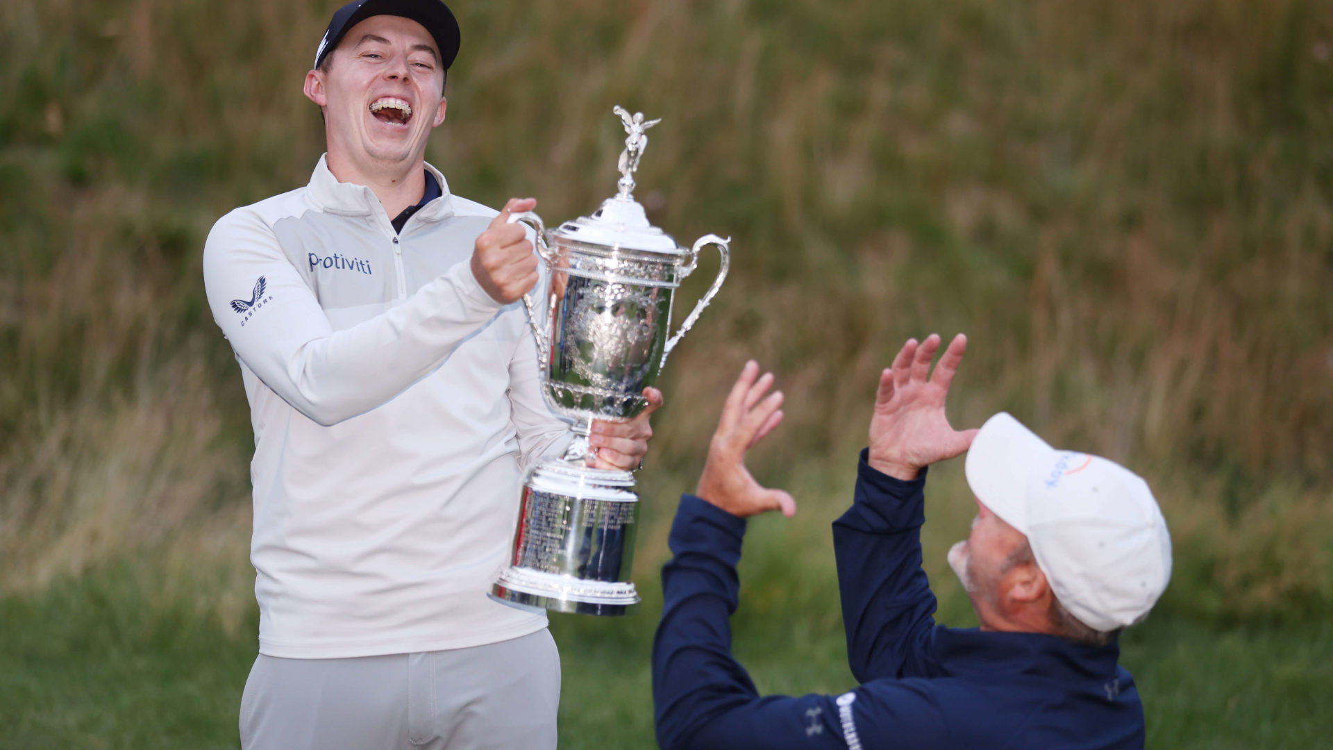 BROOKLINE, MASSACHUSETTS - JUNE 19: (L-R) Matt Fitzpatrick of England and caddie Billy Foster celebrate with the U.S. Open Championship trophy after winning during the final round of the 122nd U.S. Open Championship at The Country Club on June 19, 2022 in Brookline, Massachusetts. (Photo by Warren Little/Getty Images)