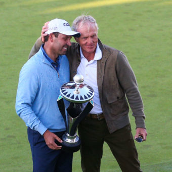 ST ALBANS, ENGLAND - JUNE 11: Charl Schwartzel of South Africa holds the winners trophy and poses for a photo with Greg Norman, LIV Golf CEO, after day three of the LIV Golf Invitational at The Centurion Club on June 11, 2022 in St Albans, England. liv golf (Photo by Craig Mercer/MB Media/Getty Images)