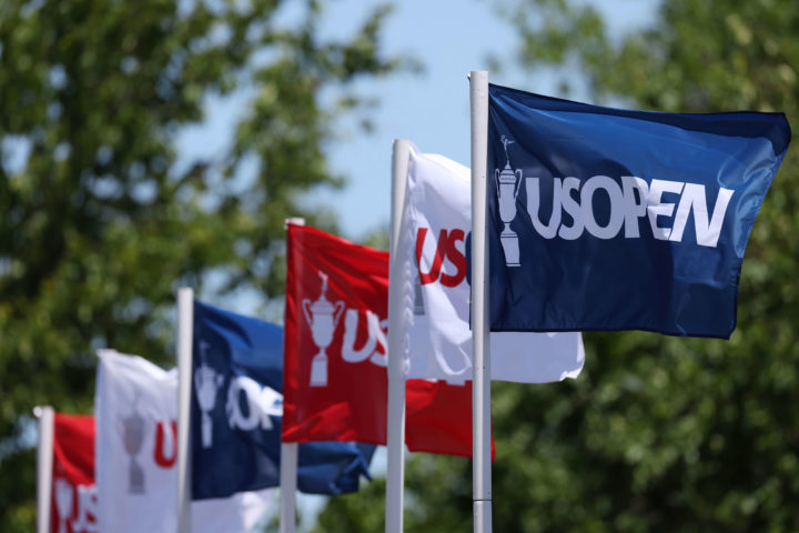 BROOKLINE, MASSACHUSETTS - JUNE 14: U.S. Open flags blow in the breeze on the practice range during a practice round prior to the US Open at The Country Club on June 14, 2022 in Brookline, Massachusetts. (Photo by Rob Carr/Getty Images)