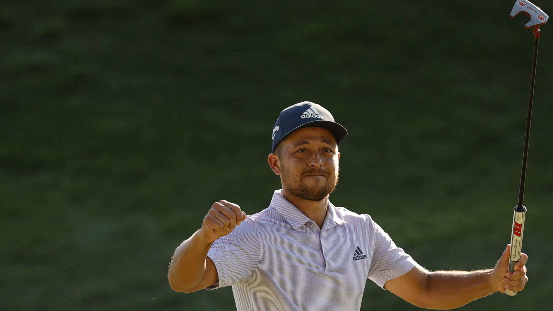 CROMWELL, CONNECTICUT - JUNE 26: Xander Schauffele of the United States reacts after putting in to win on the 18th green during the final round of Travelers Championship at TPC River Highlands on June 26, 2022 in Cromwell, Connecticut. (Photo by Tim Nwachukwu/Getty Images)