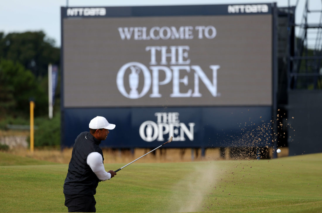 ST ANDREWS, SCOTLAND - JULY 11: Tiger Woods of The United States plays a shot from the bunker on the 3rd during a practice round prior to The 150th Open at St Andrews Old Course on July 11, 2022 in St Andrews, Scotland. (Photo by Harry How/Getty Images)