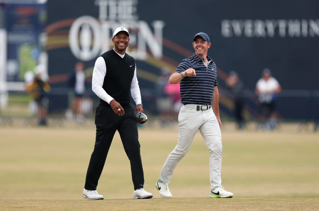 ST ANDREWS, SCOTLAND - JULY 11: Tiger Woods of The USA and Rory McIlroy of Northern Ireland on the 18th fairway during the Celebration of Champions prior to The 150th Open at St Andrews Old Course on July 11, 2022 in St Andrews, Scotland. (Photo by Oisin Keniry/R&A/R&A via Getty Images)