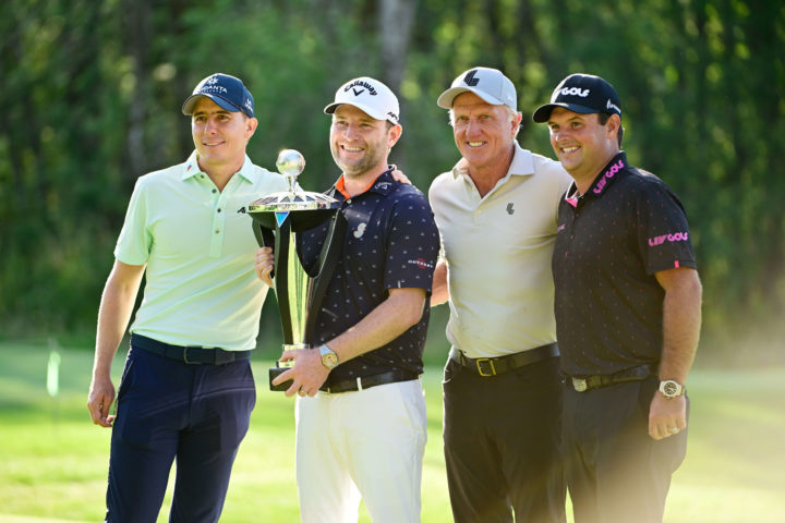 NORTH PLAINS, OREGON - JULY 02: Greg Norman (2nd R), CEO and commissioner of LIV Golf, Branden Grace (2nd L) of Stinger GC poses with the trophy first place individual alongside second place Carlos Ortiz (L) of Fireballs GC and third place Patrick Reed (R) of 4 Aces GC during day three of the LIV Golf Invitational - Portland at Pumpkin Ridge Golf Club on July 02, 2022 in North Plains, Oregon. (Photo by Charles Laberge/LIV Golf via Getty Images)