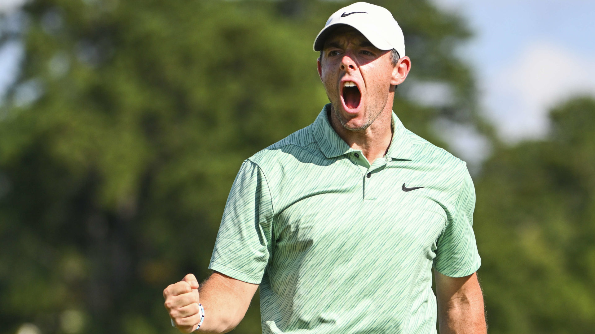 ATLANTA, GEORGIA - AUGUST 28: Rory McIlroy of Northern Ireland pumps his fist after making birdie at the 15th green during the final round of the TOUR Championship at East Lake Golf Club on August 28, 2022 in Atlanta, Georgia. tour news(Photo by Tracy Wilcox/PGA TOUR via Getty Images)