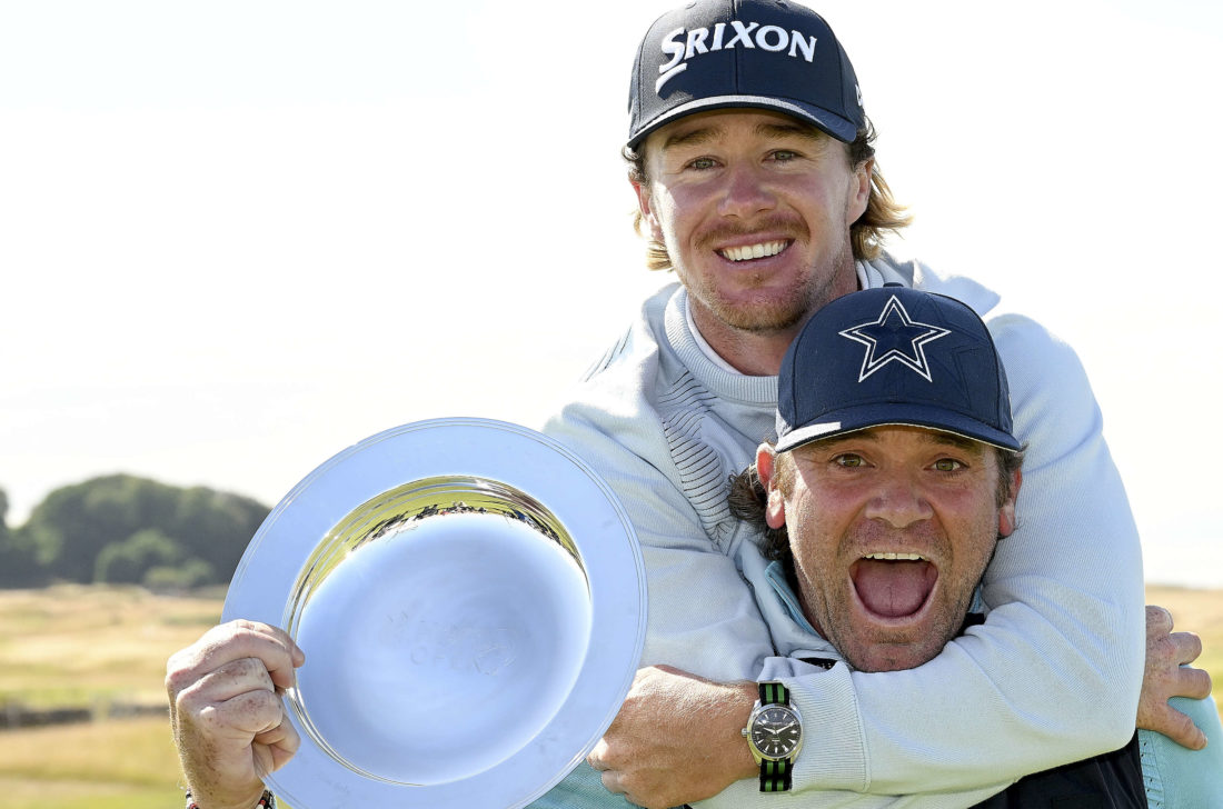 ST ANDREWS, SCOTLAND tour news - JULY 31: Sean Crocker of United States and his his caddie Steve Pettit poses with the Hero Open trophy after winning the Hero Open during Day Four of the Hero Open at Fairmont St Andrews on July 31, 2022 in St Andrews, Scotland. (Photo by Ross Kinnaird/Getty Images)