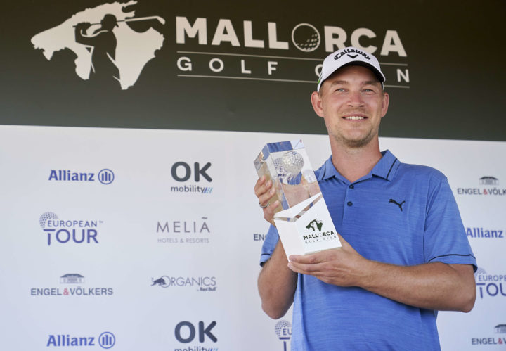 Jeff Winther of Denmark celebrates with the winners trophy after the final round during Day Four of the Mallorca Golf Open at Golf Santa Ponsa on October 24, 2021 in Mallorca, Spain. (Photo by Manuel Queimadelos/Quality Sport Images/Getty Images)