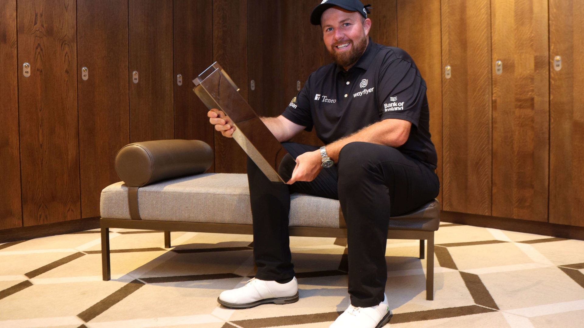 VIRGINIA WATER, ENGLAND - SEPTEMBER 11: Shane Lowry of Ireland poses for a photograph with the BMW PGA Championship trophy in the player's locker room after winning the tournament during Round Three on Day Four of the BMW PGA Championship at Wentworth Golf Club on September 11, 2022 in Virginia Water, England. tour news (Photo by Andrew Redington/Getty Images)