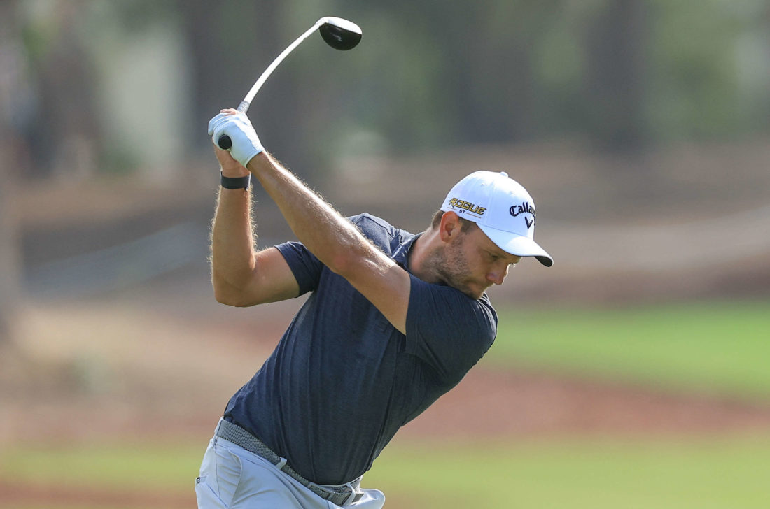 DUBAI, UNITED ARAB EMIRATES - NOVEMBER 20: Maximillian Kieffer of Germany plays his second shot on the 14th hole during the final round on Day Four of the DP World Tour Championship on the Earth Course at Jumeirah Golf Estates on November 20, 2022 in Dubai, United Arab Emirates. tour news (Photo by David Cannon/Getty Images)