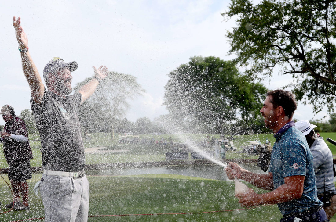 MALELANE, SOUTH AFRICA - DECEMBER 11: Ockie Strydom of South Africa being sprayed champagne by Erik Van Rooyen of South Africa after winning the Alfred Dunhill Championship on the 18th Hole during Day Four of the Alfred Dunhill Championship at Leopard Creek Country Club on December 11, 2022 in Malelane, South Africa. tour news (Photo by Warren Little/Getty Images)