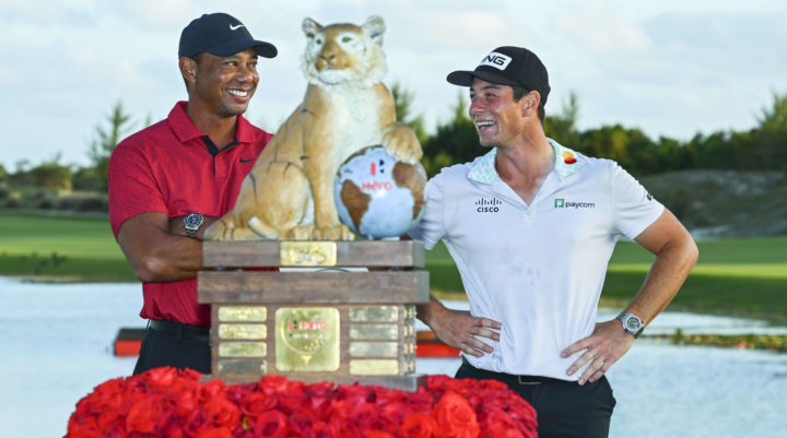 NASSAU, BAHAMAS - DECEMBER 04: Two-time champion, Viktor Hovland of Norway laughs with the only other two-time champion of this event, Tiger Woods, during the trophy ceremony after the final round, during the trophy ceremony, of the Hero World Challenge at Albany on December 4, 2022 in Nassau, New Providence, Bahamas. tour news (Photo by Tracy Wilcox/PGA TOUR via Getty Images)