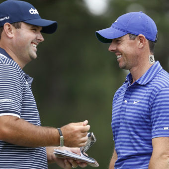 CHARLOTTE, NORTH CAROLINA - MAY 06: (L-R) Patrick Reed of the United States and Rory McIlroy of Northern Ireland smile on the ninth green during the first round of the 2021 Wells Fargo Championship at Quail Hollow Club on May 06, 2021 in Charlotte, North Carolina. (Photo by Maddie Meyer/Getty Images)