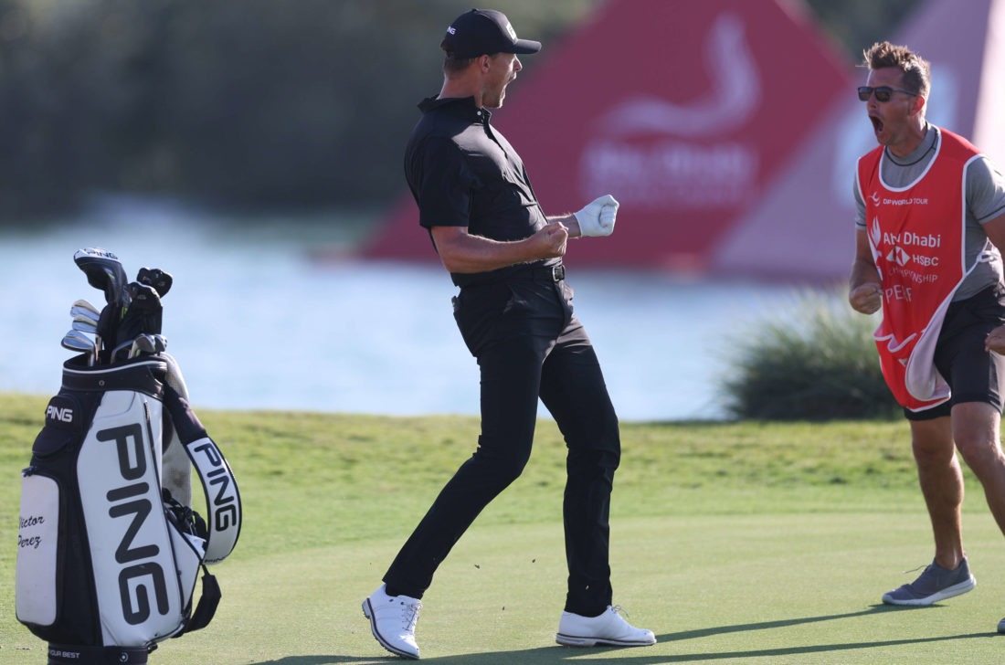 ABU DHABI, UNITED ARAB EMIRATES - JANUARY 22: Victor Perez of France and his caddie James Erkenbeck celebrate after a birdie on the seventeenth hole during the final round of the Abu Dhabi HSBC Championship at Yas Links Golf Course on January 22, 2023 in Abu Dhabi, United Arab Emirates. tour news (Photo by Oisin Keniry/Getty Images)