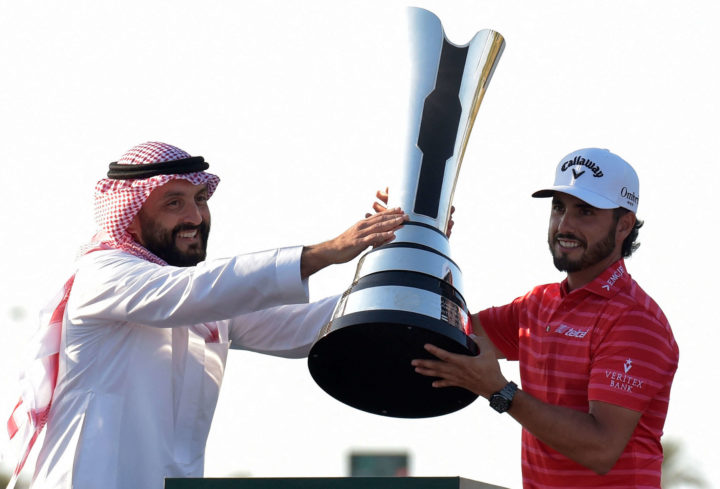 Golf Saudi CEO Noah Alireza presents the trophy to Abraham Ancer of Mexico for winning the PIF Saudi International in King Abdullah Economic City, north of Jeddah, on February 5, 2023. (Photo by Amer HILABI / AFP) (Photo by AMER HILABI/AFP tour news via Getty Images)