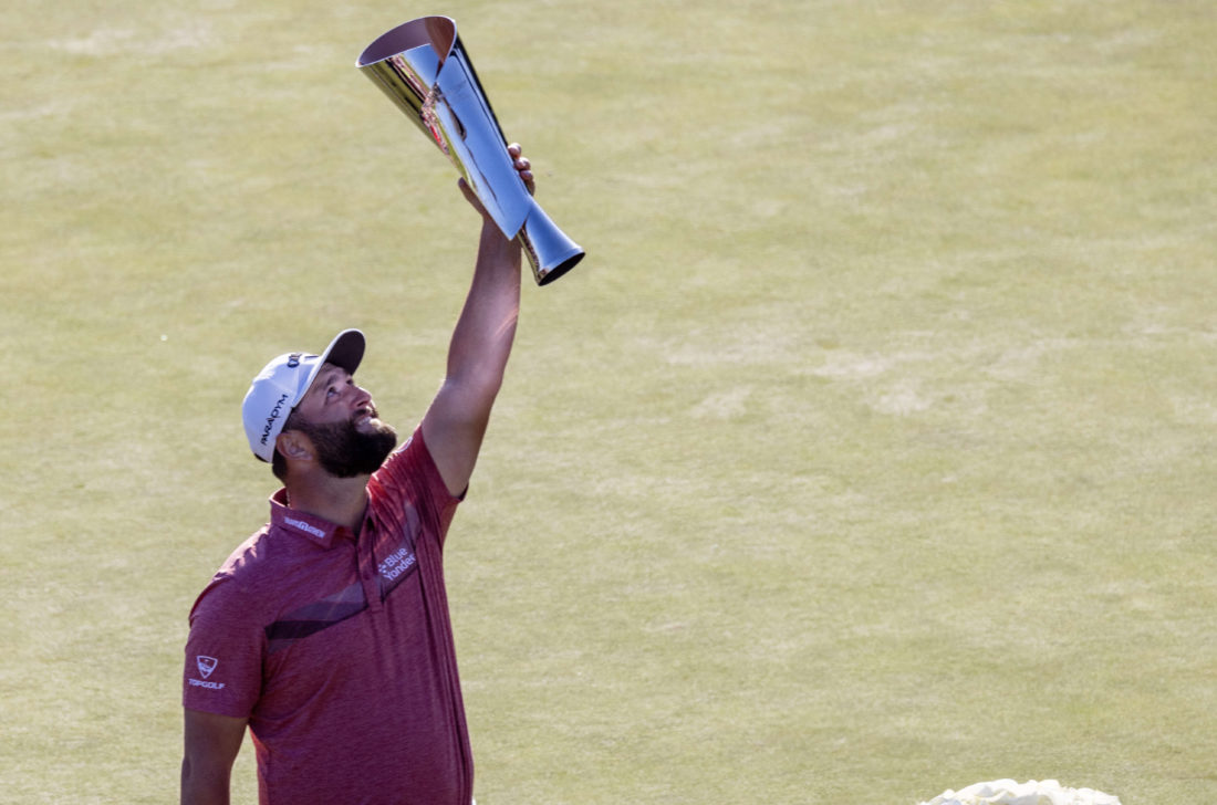 PACIFIC PALISADES, CA - FEBRUARY 19, 2023: Jon Rahm hoists the trophy after winning the Genesis Invitational at Riviera Country Club on February 19, 2023 in Pacific Palisades, California. (Gina Ferazzi / Los Angeles Times via Getty Images) tour news