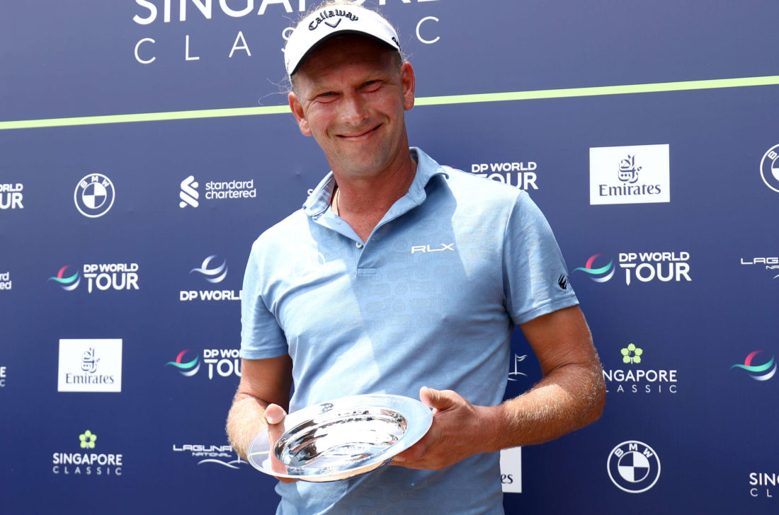 SINGAPORE, SINGAPORE - FEBRUARY 09: Marcel Siem of Germany receives a trophy to commemorate his 500th tour appearance during Day One of the Singapore Classic at Laguna National Golf Resort Club on February 09, 2023 in Singapore. tour news (Photo by Yong Teck Lim/Getty Images)