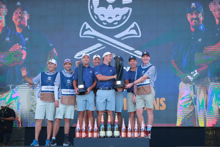 PLAYA DEL CARMEN, MEXICO -getty news FEBRUARY 26: Anirban Lahiri, Paul Casey, Bryson DeChambeau and Charles Howell III and caddies of Crushers GC celebrate with the trophy on the podium after winning the team award during day three of the LIV Golf Invitational - Mayakoba at El Camaleon at Mayakoba on February 26, 2023 in Playa del Carmen, Mexico. (Photo by Hector Vivas/Getty Images) Getty images