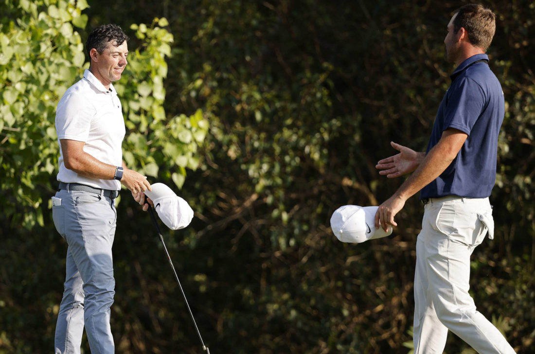 AUSTIN, TEXAS - MARCH 26: Rory McIlroy of Northern Ireland (L) and Scottie Scheffler of the United States shake hands on the 17th green after McIlroy won their match 2 & 1 during day five of the World Golf Championships-Dell Technologies Match Play at Austin Country Club on March 26, 2023 in Austin, Texas. (Photo by Mike Mulholland/Getty Images) tour news