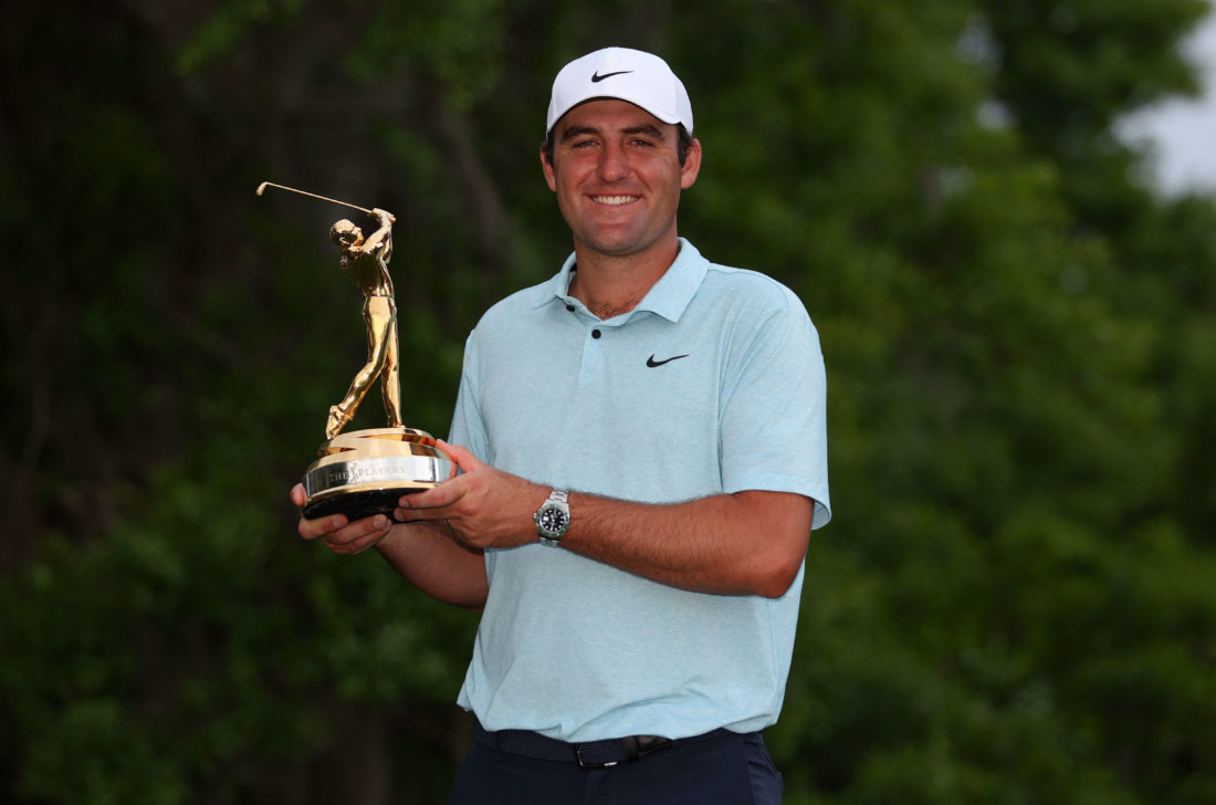 PONTE VEDRA BEACH, FLORIDA - MARCH 12: Scottie Scheffler of the United States celebrates with the trophy after winning during the final round of THE PLAYERS Championship on THE PLAYERS Stadium Course at TPC Sawgrass on March 12, 2023 in Ponte Vedra Beach, Florida. (Photo by Richard Heathcote/Getty Images) tour news