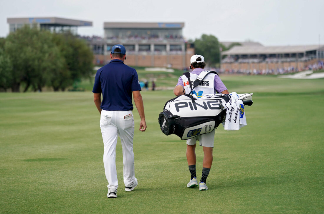 SAN ANTONIO, TEXAS - APRIL 02: Corey Conners of Canada and his caddie walk across the 18th hole during the final round of the Valero Texas Open at TPC San Antonio on April 02, 2023 in San Antonio, Texas. (Photo by Alex Bierens de Haan/Getty Images) tour news