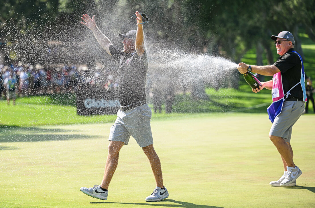 CADIZ, SPAIN - JULY 2: Talor Gooch of RangeGoats GC is sprayed with champagne by his caddy after sinking a birdie putt on the 18th hole and wins the LIV Golf - Andalucia at Real Club Valderrama on July 2, 2023 in Cadiz, Spain. (Photo by Octavio Passos/Getty Images) tour news