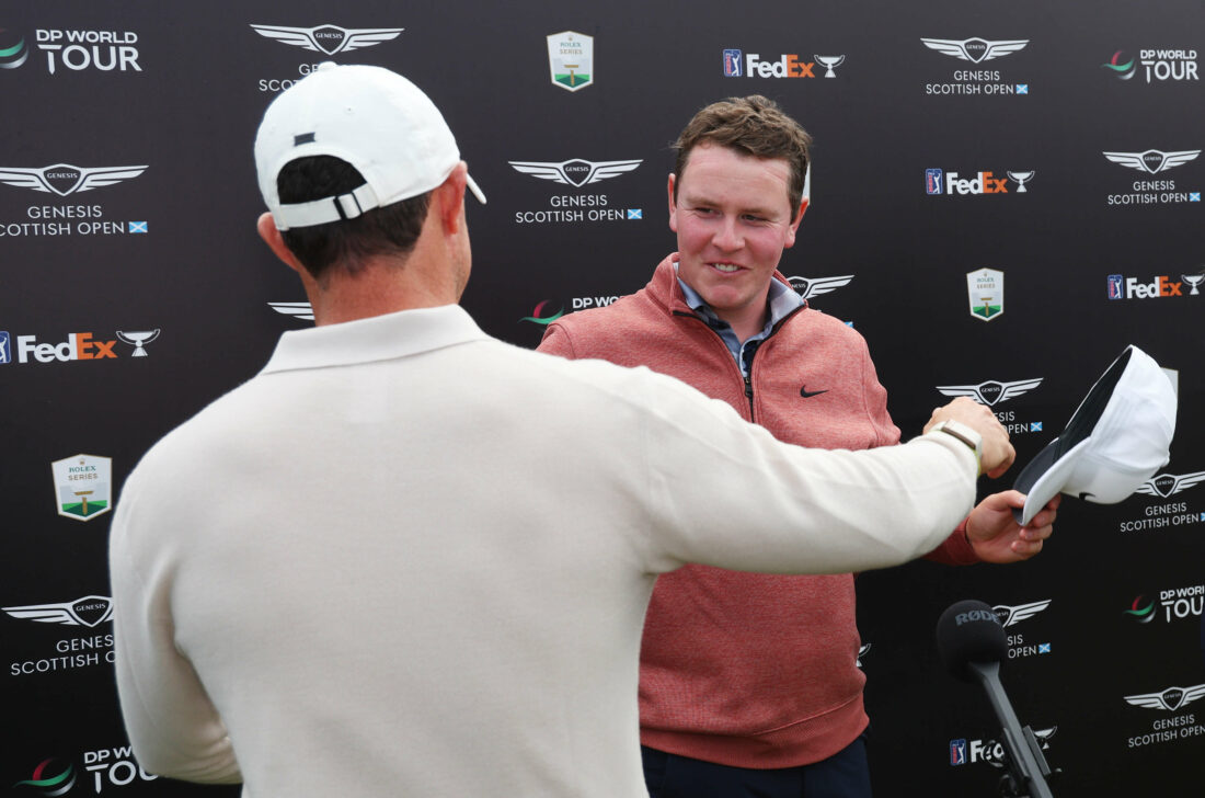 NORTH BERWICK, SCOTLAND - JULY 16: Champion, Rory McIlroy of Northern Ireland and runner-up, Robert MacIntyre of Scotland embrace after finishing their rounds during Day Four of the Genesis Scottish Open at The Renaissance Club on July 16, 2023 in United Kingdom. (Photo by Andrew Redington/Getty Images) tour news