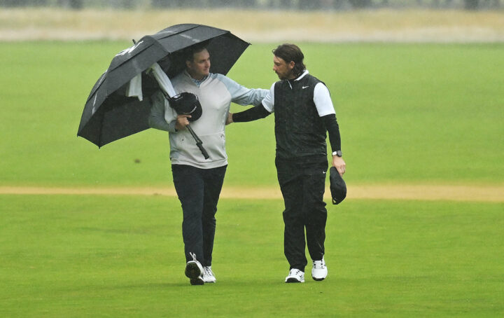 HOYLAKE, ENGLAND - JULY 23: Tommy Fleetwood of England interacts with Sepp Straka of Austria as they make their way down the 18th fairway during Day Four of The 151st Open at Royal Liverpool Golf Club on July 23, 2023 in Hoylake, England. (Photo by Charlie Crowhurst/R&A/R&A via Getty Images)