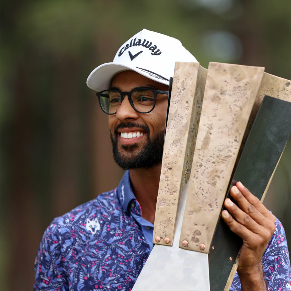 TRUCKEE, CALIFORNIA - JULY 23: Akshay Bhatia of the United States poses with the trophy after putting in to win on the 18th green during a playoff against Patrick Rodgers of the United States during the final round of the Barracuda Championship at Tahoe Mountain Club on July 23, 2023 in United States. (Photo by Isaiah Vazquez/Getty Images) tour news