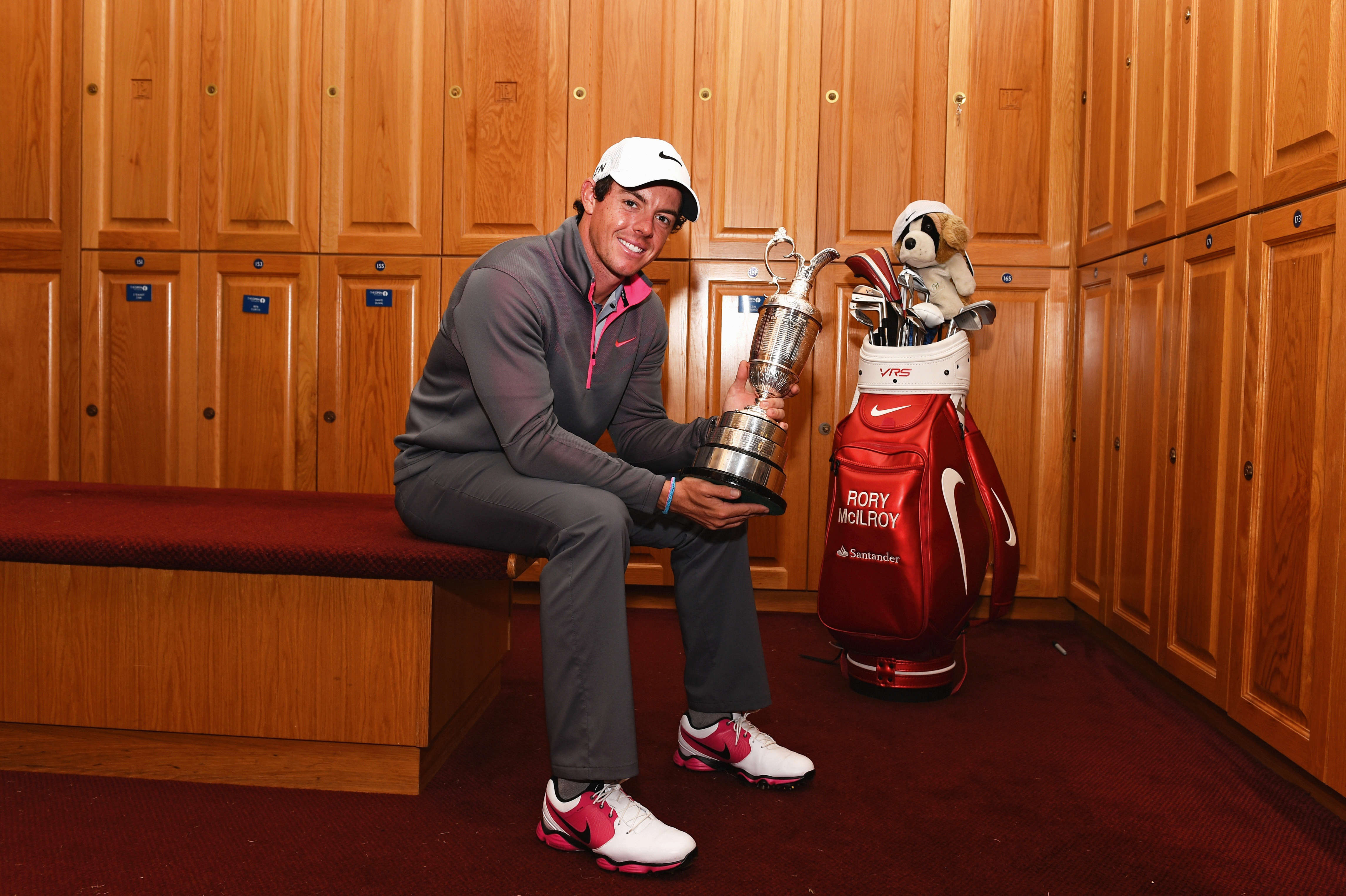 HOYLAKE, ENGLAND - JULY 20: Rory McIlroy of Northern Ireland poses with the Claret Jug in the locker room after his two-stroke victory in The 143rd Open Championship at Royal Liverpool on July 20, 2014 in Hoylake, England. (Photo by Ian Walton/R&A/R&A via Getty Images)