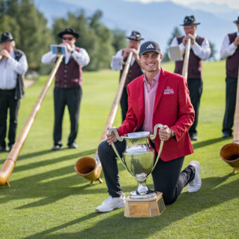 Sweden's Ludvig Aberg poses with the trophy surrounded by alphorn blowers after winning the European Tour's European Masters golf tournament in Crans Montana, western Switzerland on September 3, 2023. (Photo by Fabrice COFFRINI / AFP) (Photo by FABRICE COFFRINI/AFP via Getty Images) tour news