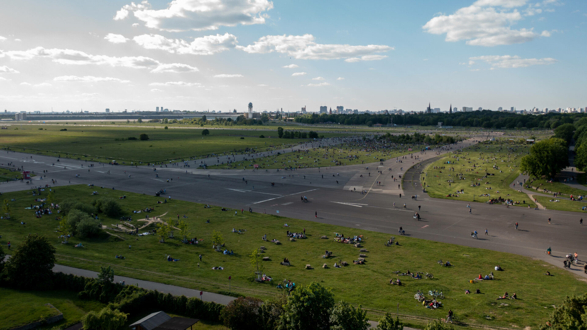 BERLIN, GERMANY - MAY 30: In an aerial view, people relax at Tempelhofer Feld public park during the coronavirus pandemic on May 30, 2021 in Berlin, Germany. While the pandemic is continuing in Germany, infection rates have come down sharply and the number of vaccinations is climbing steadily, allowing authorities to ease many lockdown measures and giving Germans hope that a return to normalcy is getting closer. (Photo by Christian Ender/Getty Images)